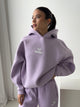 Women's lavender hooded sweatshirt with long sleeves and front logo