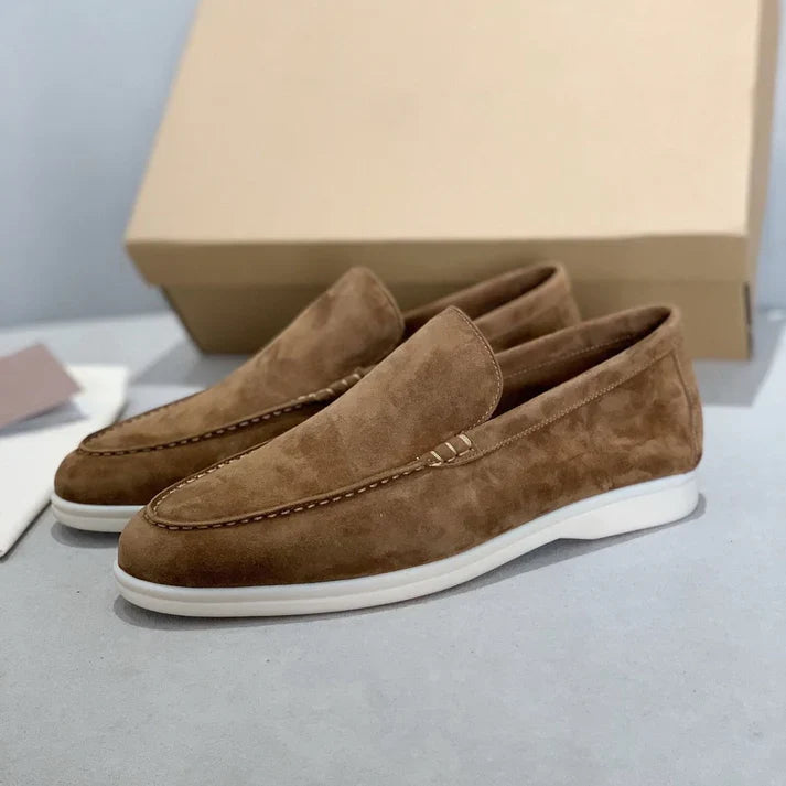 Slip-on loafers with moc-toe stitching and flat contrasting soles