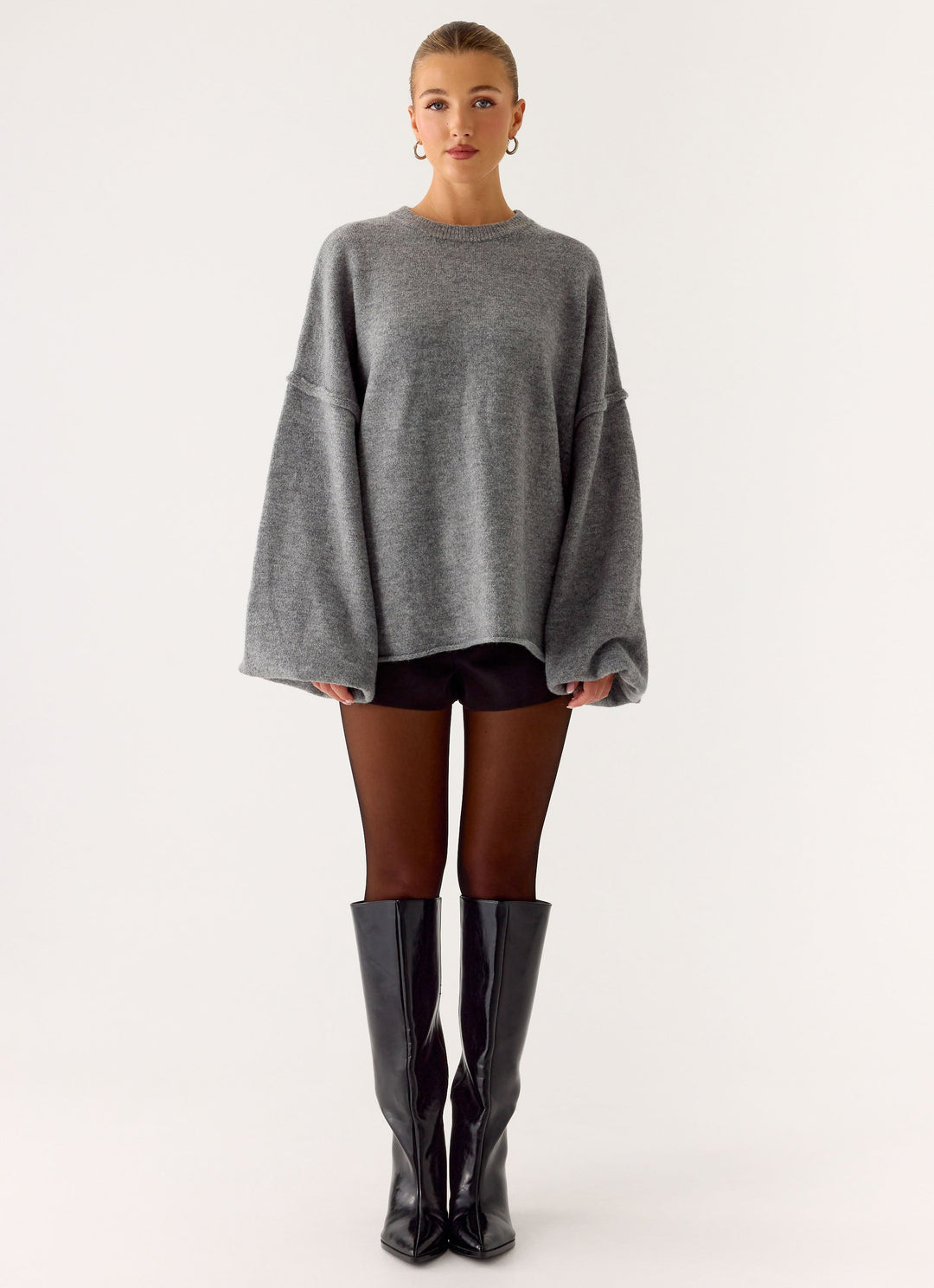 Women's grey oversized knit sweater with crew neck and wide bell sleeves
