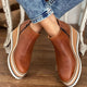 Women's ankle boots with rounded toes, side zippers and layered wedge soles