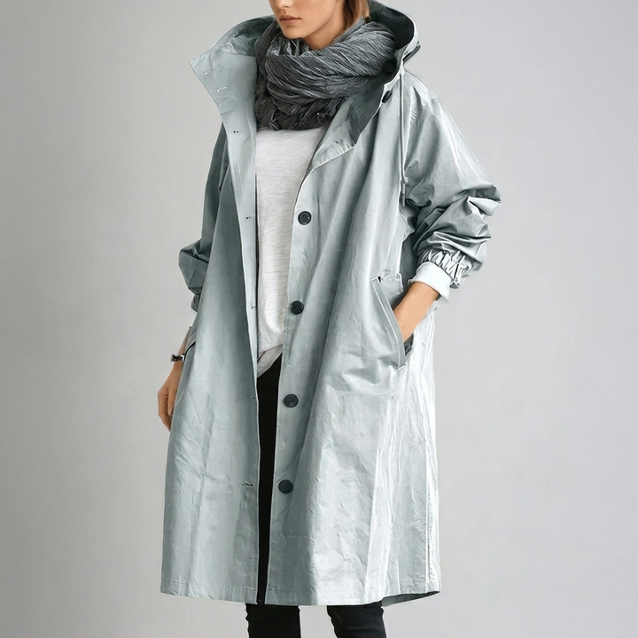 Women's long hooded trench coat with button front and elastic cuffs