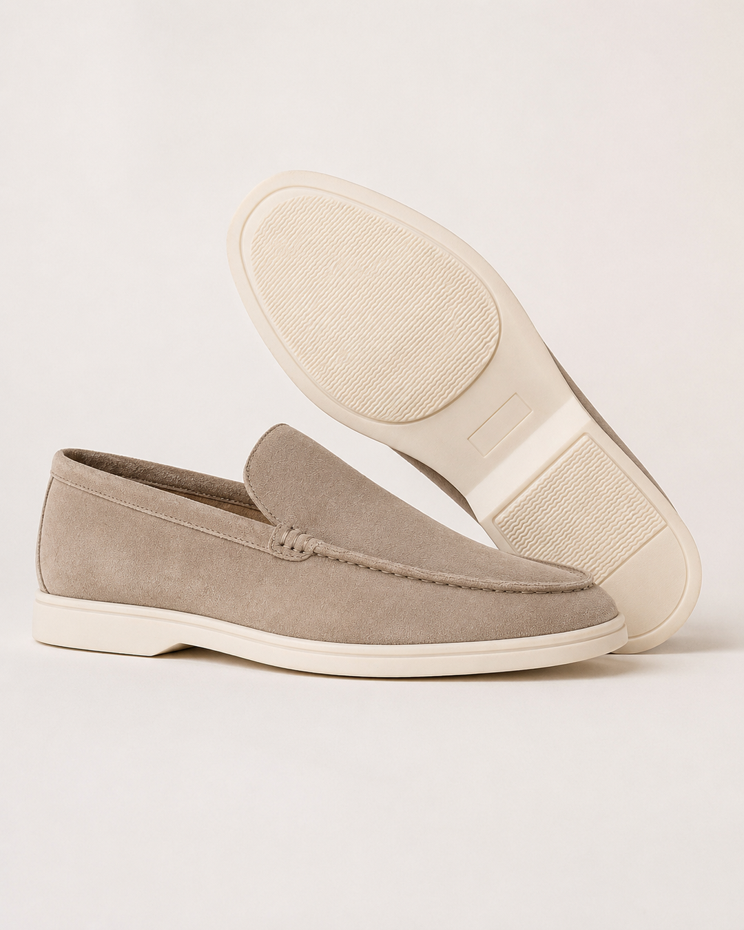Men's slip-on loafers with rounded toes, stitched apron trim and flat light soles