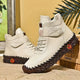 Women's lace-up combat ankle boots with chunky textured soles