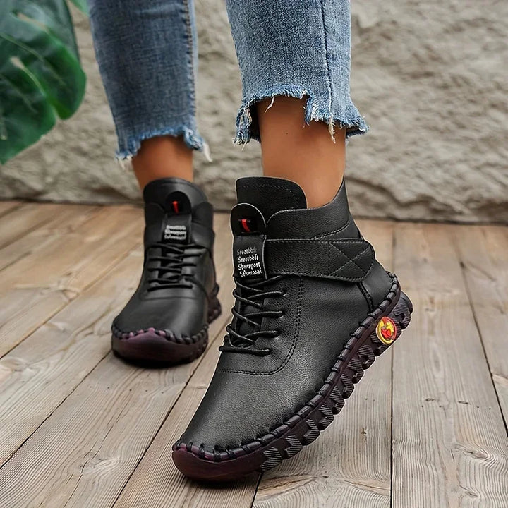 Women's lace-up combat ankle boots with chunky textured soles