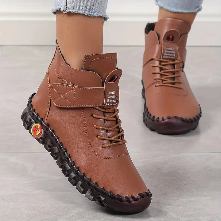 Women's lace-up combat ankle boots with chunky textured soles