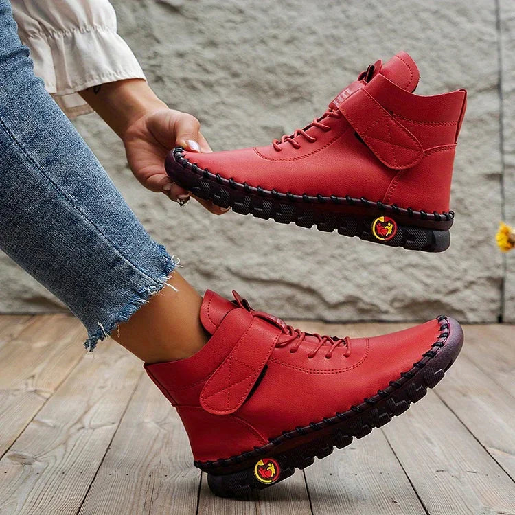 Women's lace-up combat ankle boots with chunky textured soles