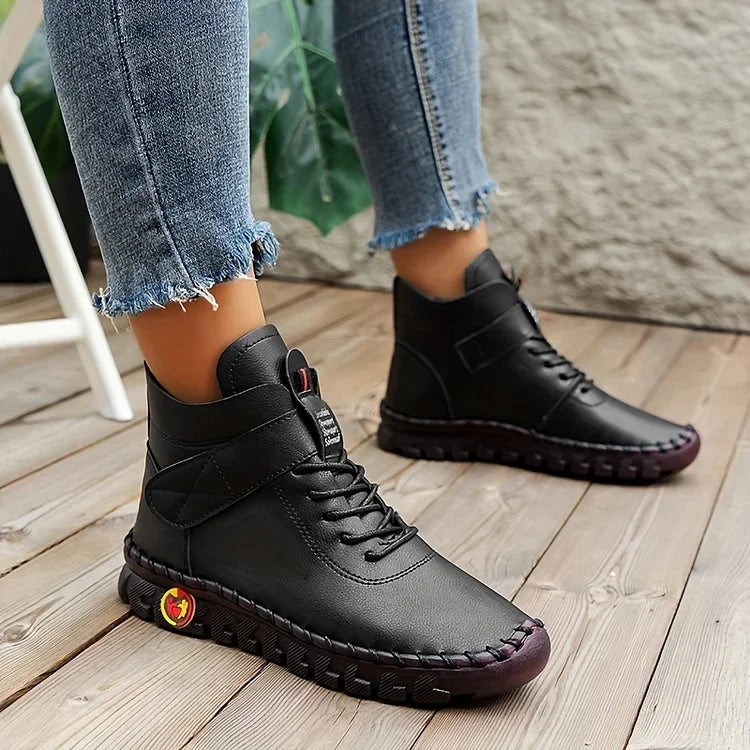 Women's lace-up combat ankle boots with chunky textured soles