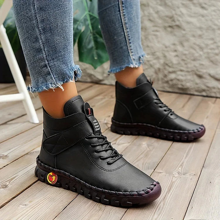 Women's lace-up combat ankle boots with chunky textured soles