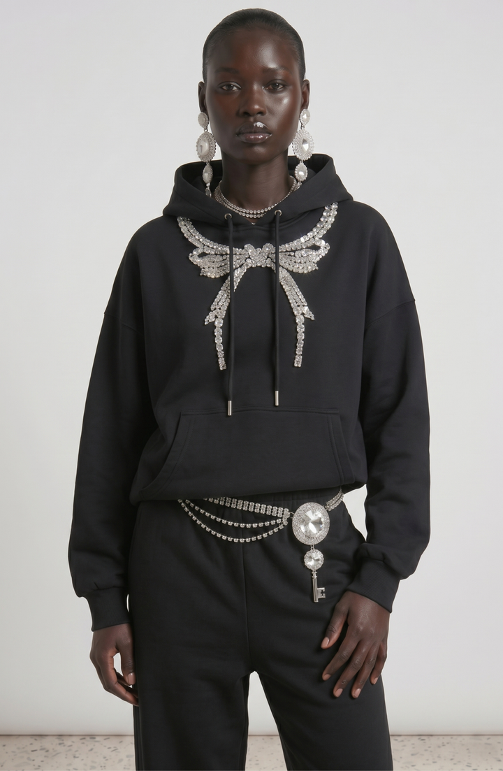 Black pullover hoodie with embellished wing detail, hood, drawstrings and front pouch pocket