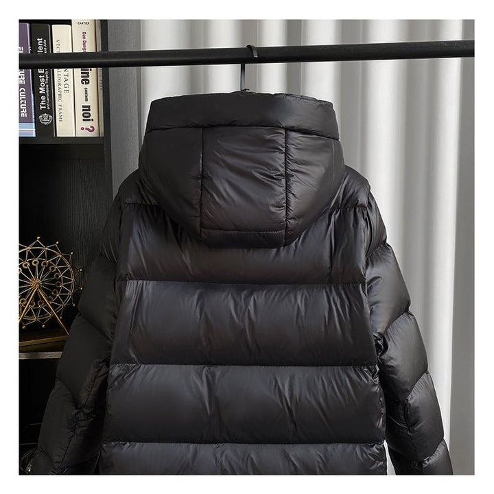 Women's black longline hooded puffer jacket with horizontal quilting