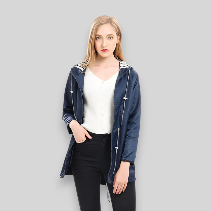 Women's hooded rain jacket with long sleeves, front zippers and striped lining