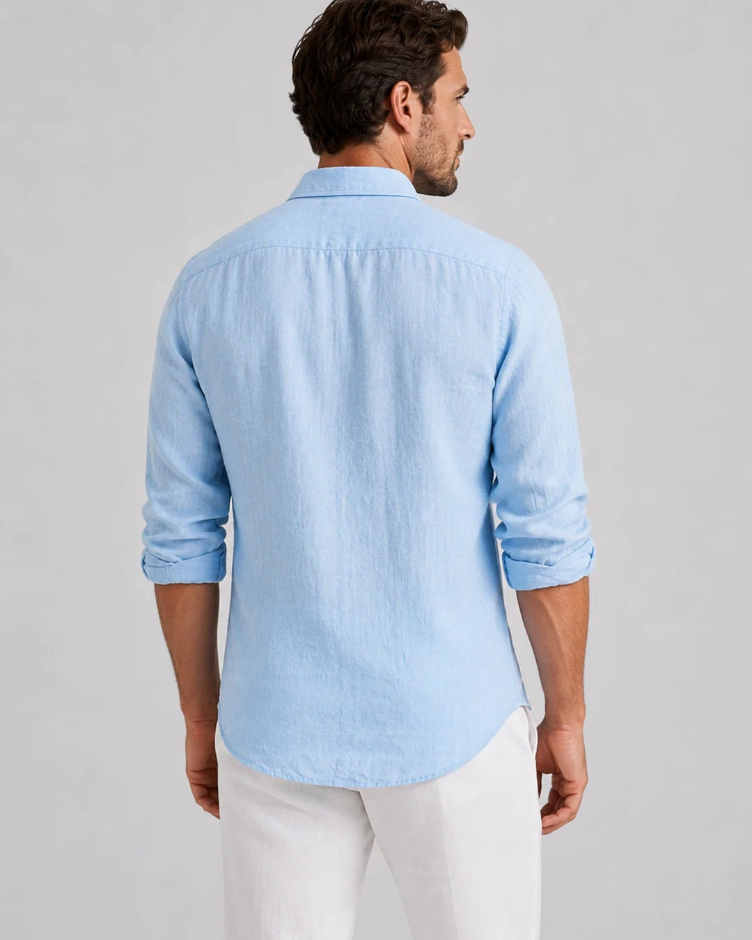 Men's long sleeve button-front shirt with pointed collar and curved hem