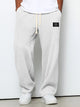 Wide leg trousers with adjustable drawstring waist and textured finish