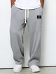 Wide leg trousers with adjustable drawstring waist and textured finish