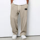 Wide leg trousers with adjustable drawstring waist and textured finish