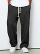 Wide leg trousers with adjustable drawstring waist and textured finish