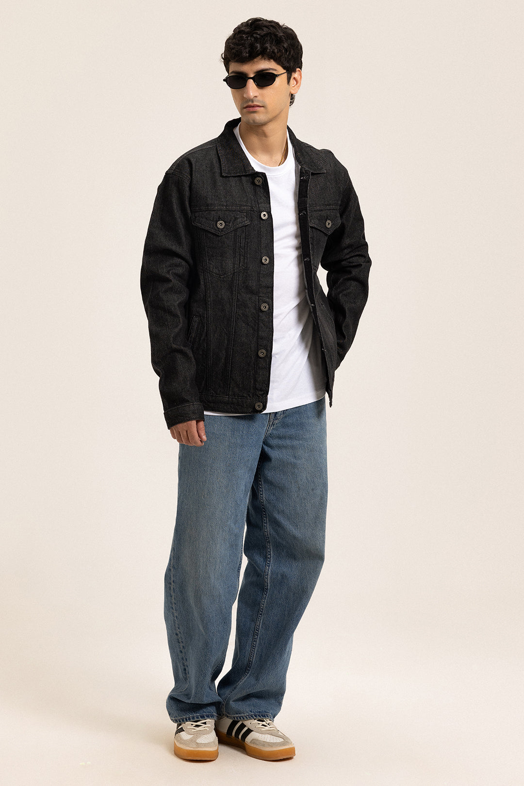 Men's black button-front denim jacket with pointed collar and chest pockets