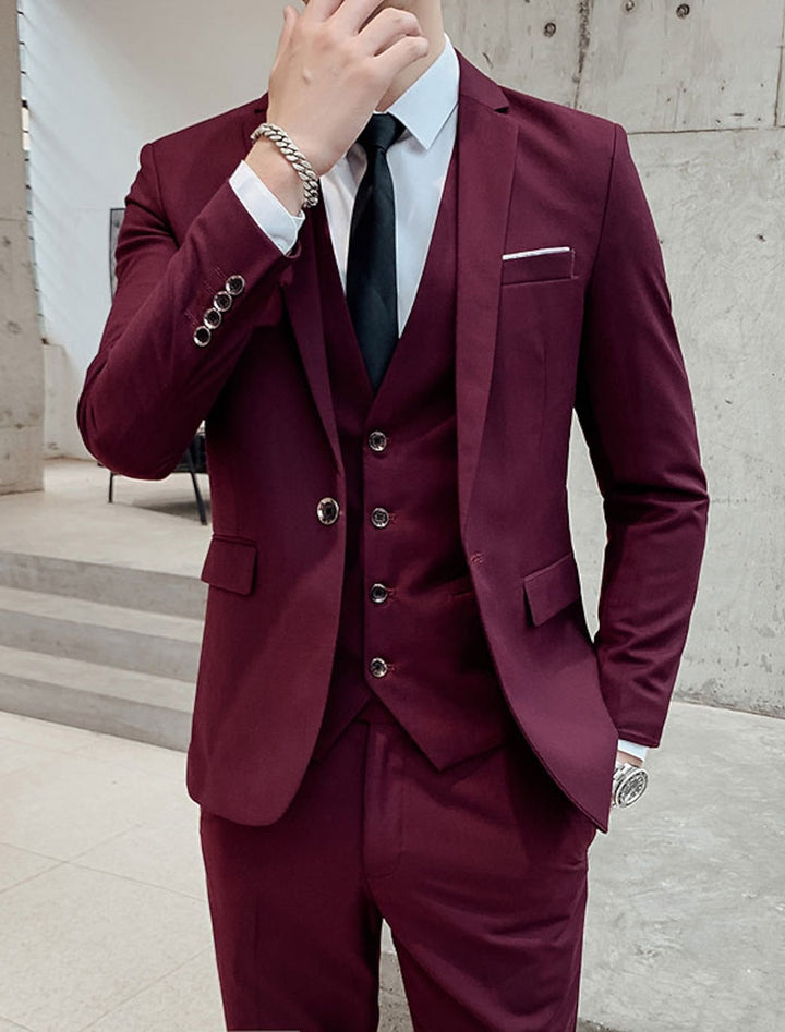 Men's single-breasted three-piece suit with notched lapels, waistcoat and tailored trousers