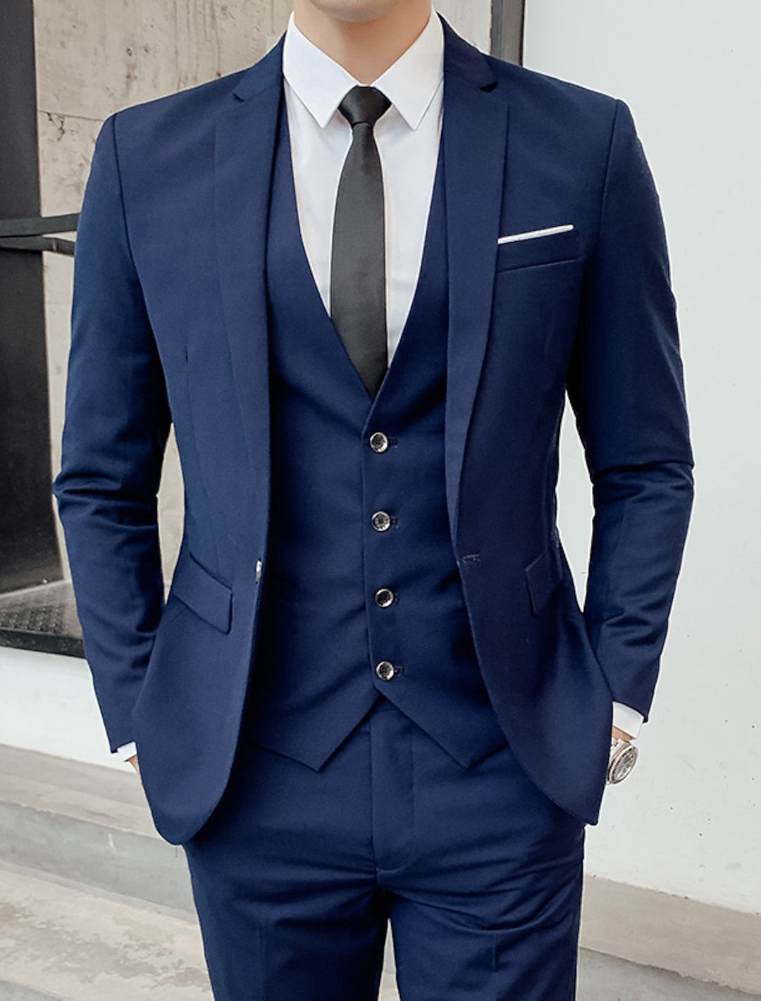 Men's single-breasted three-piece suit with notched lapels, waistcoat and tailored trousers