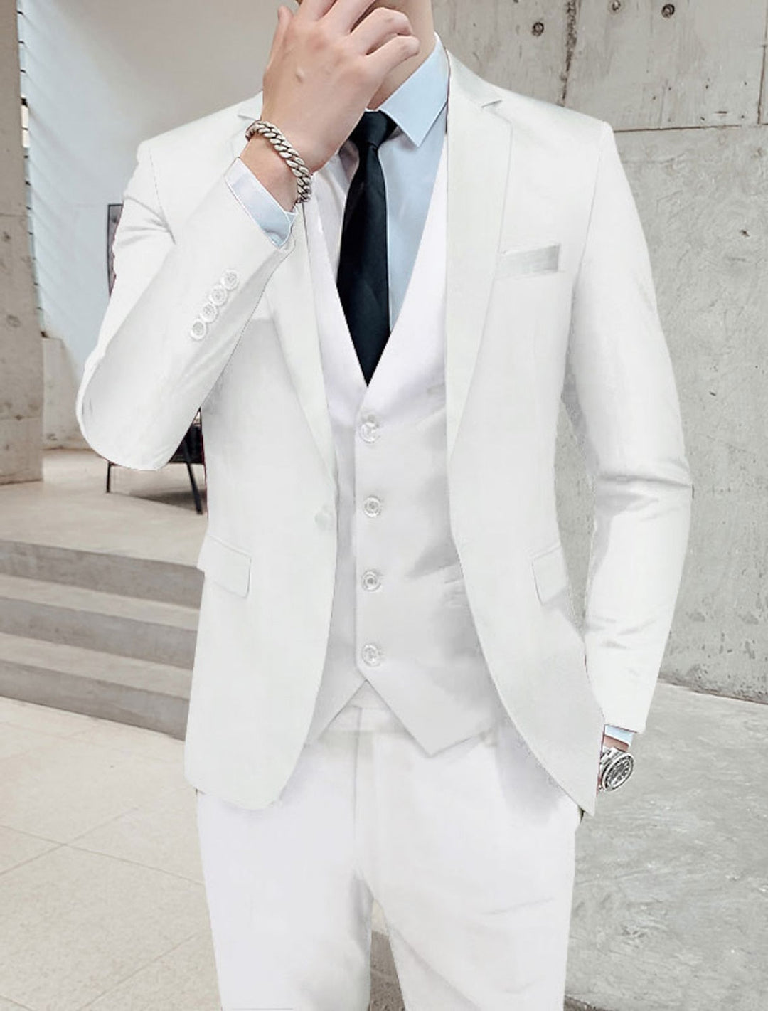 Men's single-breasted three-piece suit with notched lapels, waistcoat and tailored trousers