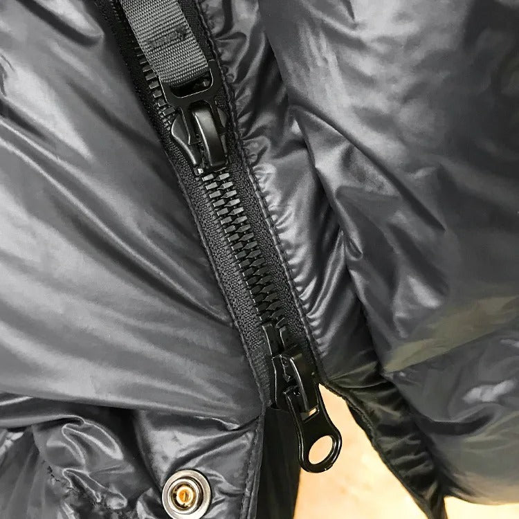 Women's black longline hooded puffer jacket with horizontal quilting