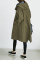 Women's long hooded button-front trench coat with angled pockets