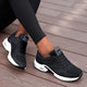 Women's low-top lace-up sneakers with perforated panels and air cushion-style soles