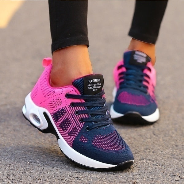 Women's low-top lace-up sneakers with perforated panels and air cushion-style soles