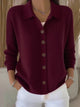 Women's button-front collared cardigan with long sleeves