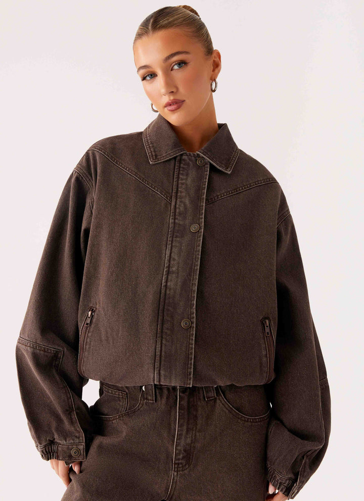Women's brown washed denim bomber jacket with cropped fit and long sleeves