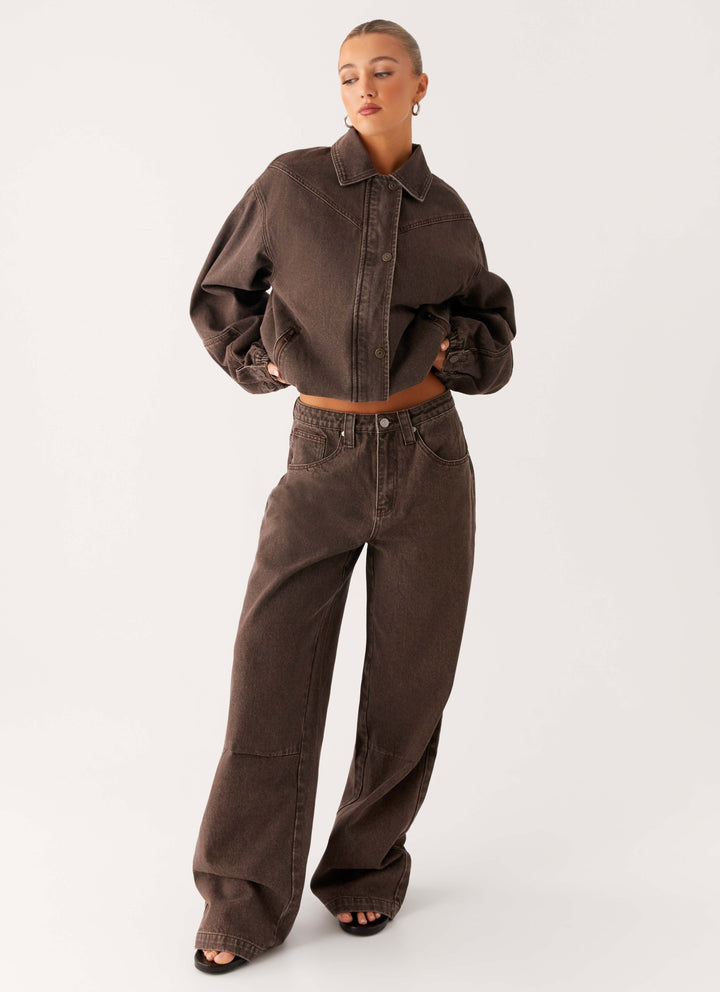 Women's brown washed denim bomber jacket with cropped fit and long sleeves