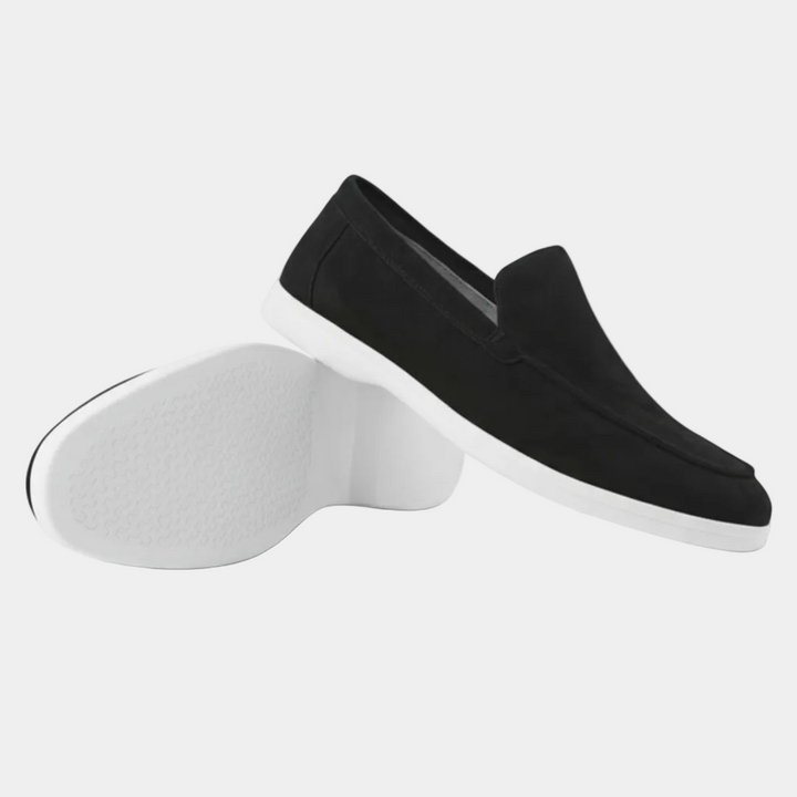 Men's slip-on loafers with visible stitching and light-coloured soles