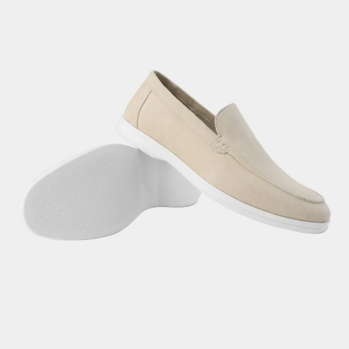 Men's slip-on loafers with visible stitching and light-coloured soles