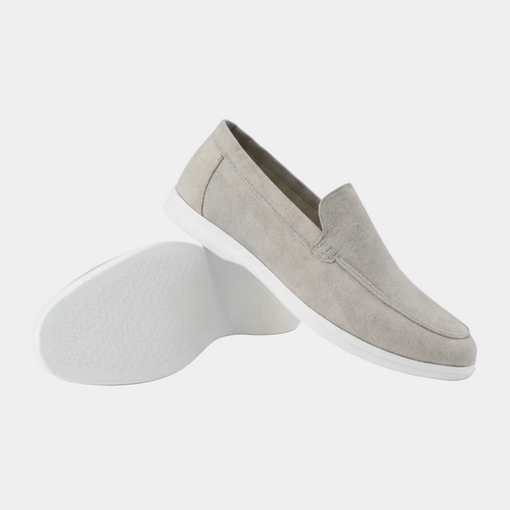 Men's slip-on loafers with visible stitching and light-coloured soles