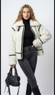 Women's white textured jacket with black trim and front zipper