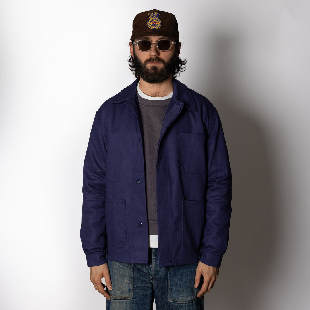 Men's navy utility jacket with point collar, button front and patch pockets