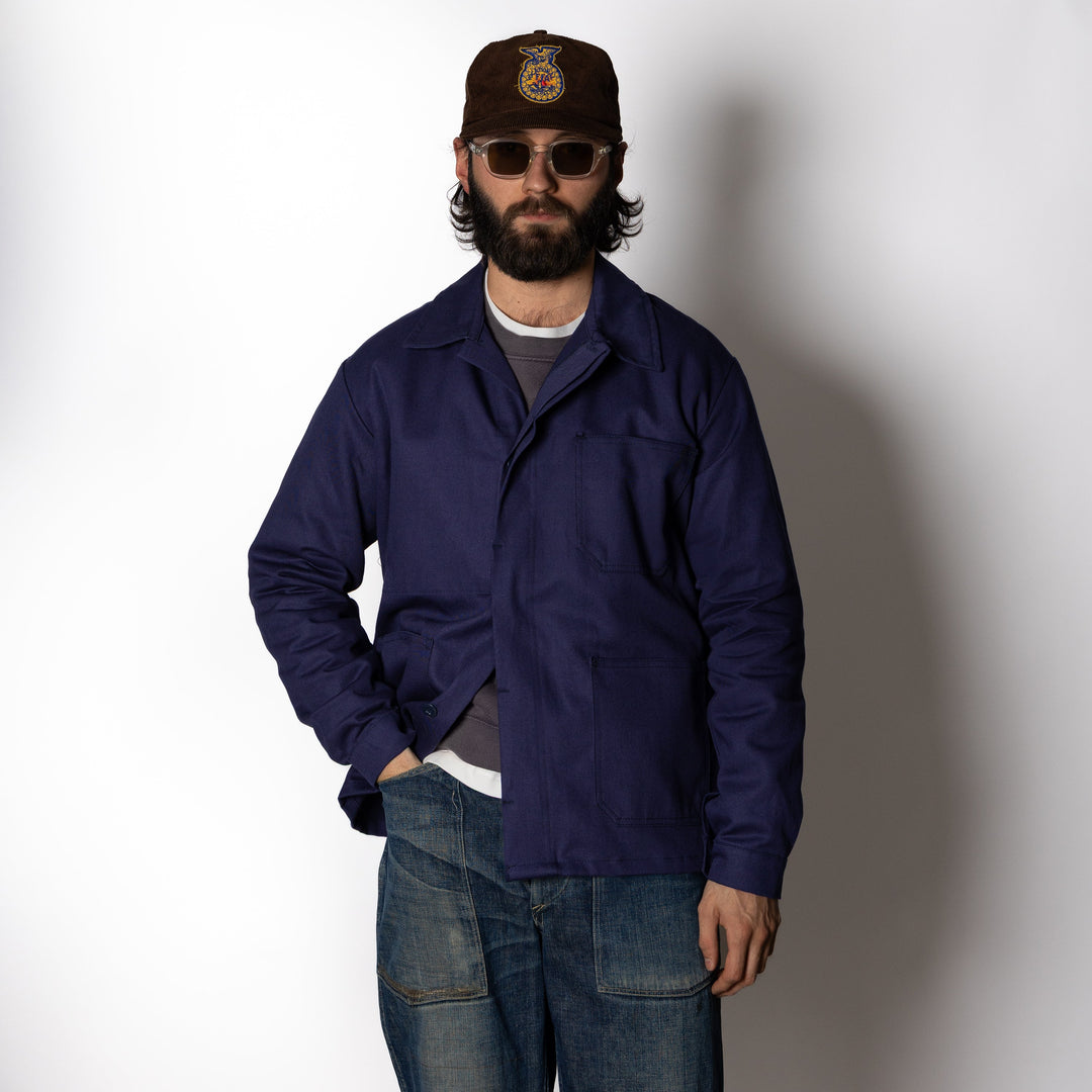 Men's navy utility jacket with point collar, button front and patch pockets