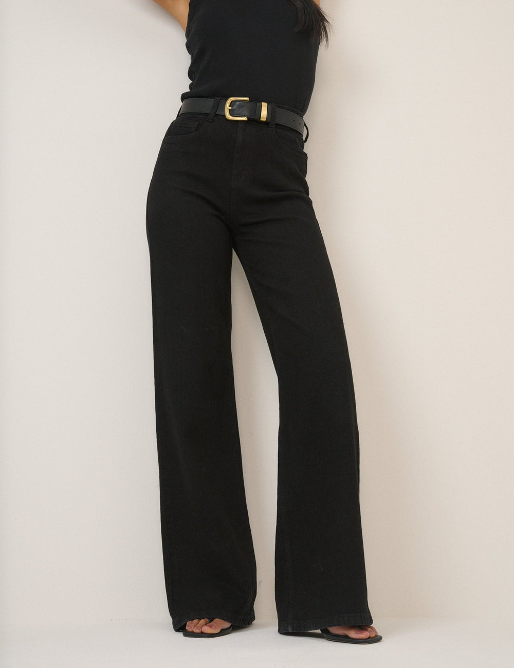 Women's black high-rise wide-leg jeans with full-length hems