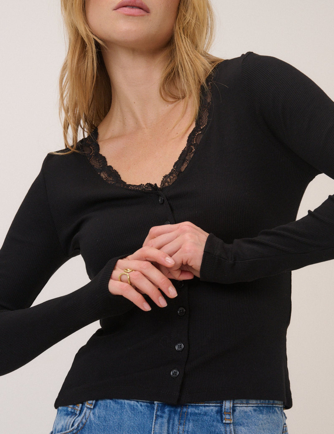 Women's black ribbed cardigan with lace-trim V-neckline and long sleeves