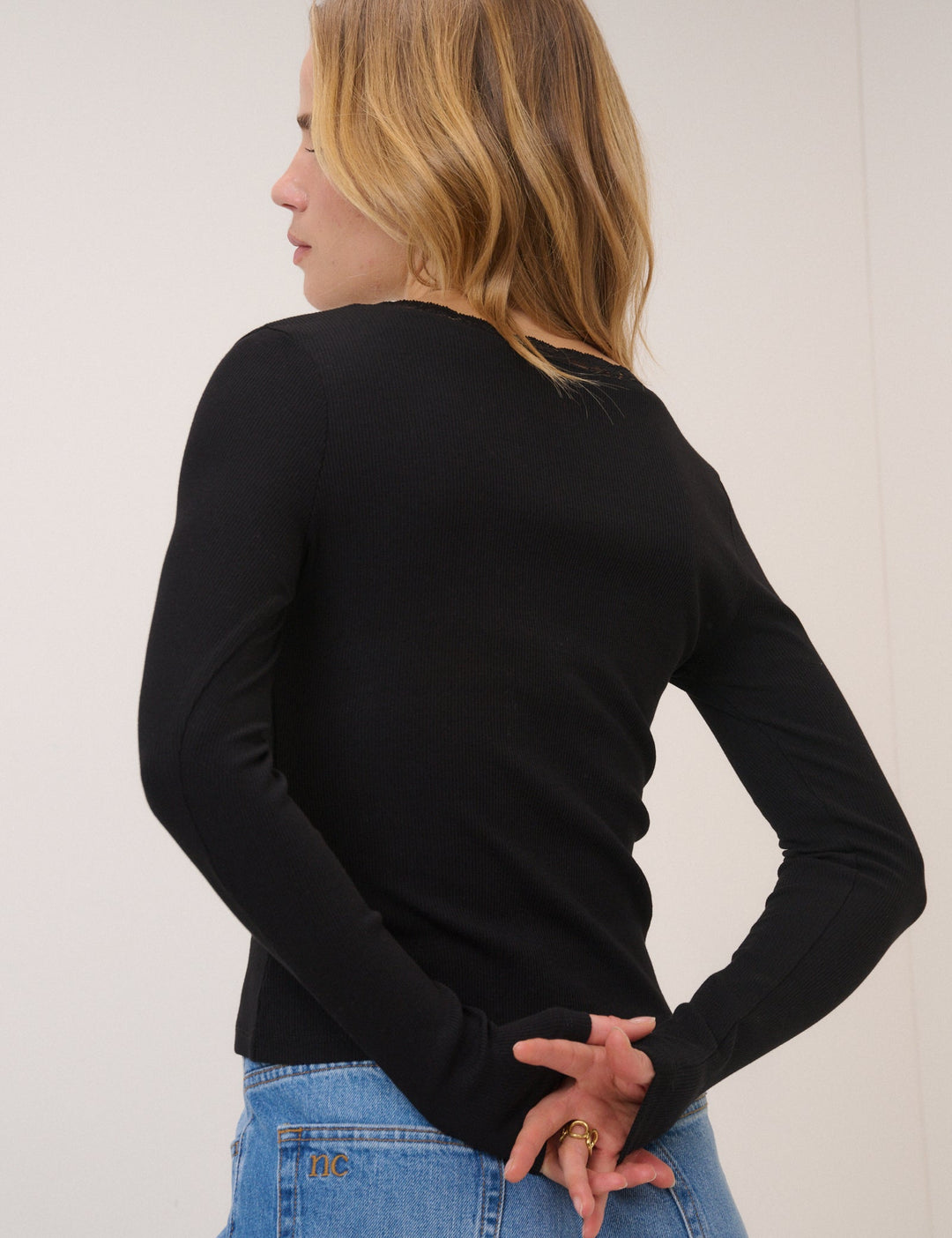 Women's black ribbed cardigan with lace-trim V-neckline and long sleeves