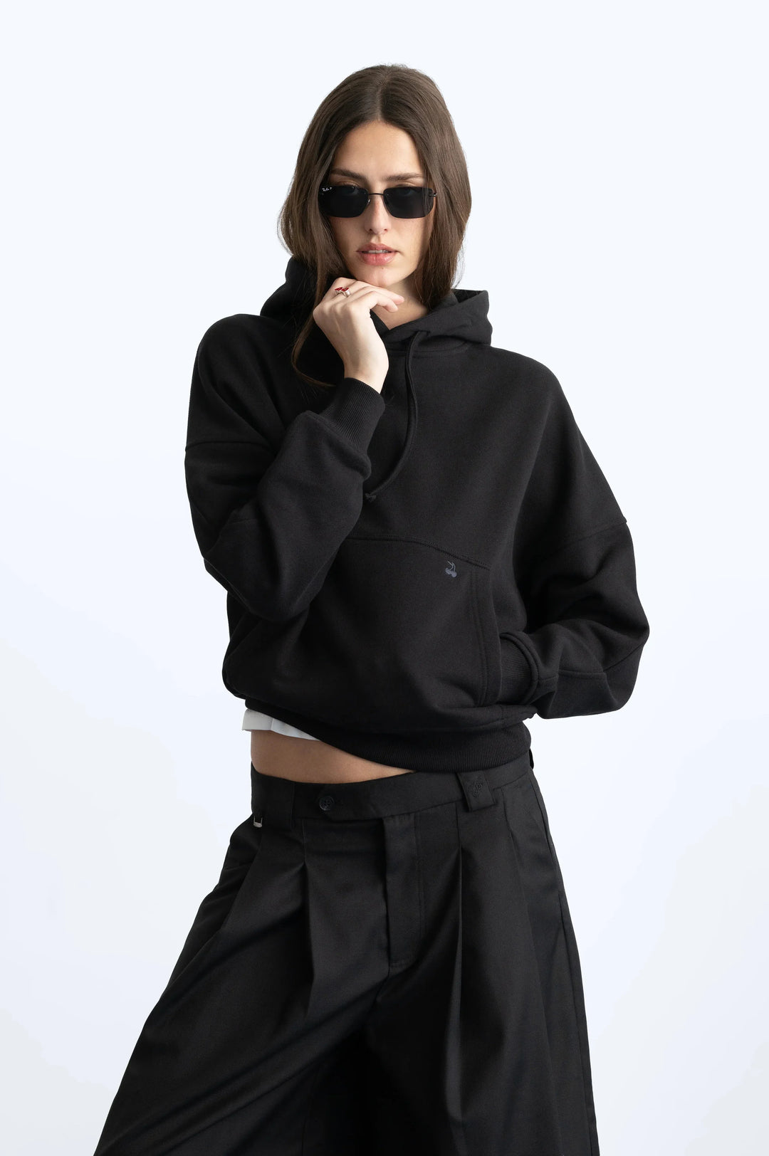 Black hooded sweatshirt with raised lettering on the back and sleeves