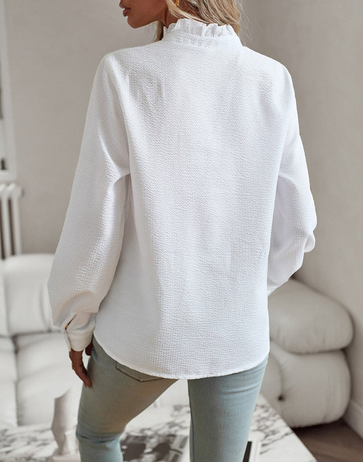 Women's ruffled button-front blouse with stand collar and long sleeves