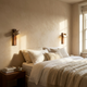 Adjustable wall light with a natural travertine stone finish