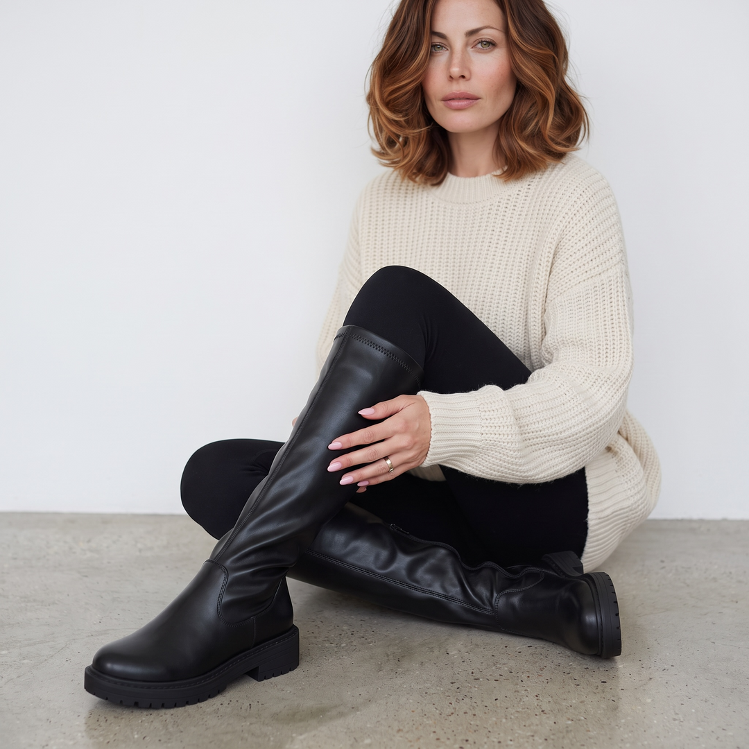 Women's black knee-high boots with round toes, low heels and side zips