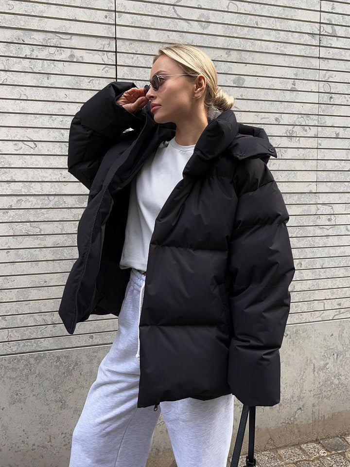 Women's oversized hooded puffer jacket with zip front