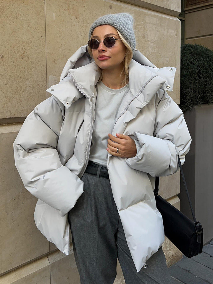 Women's oversized hooded puffer jacket with zip front