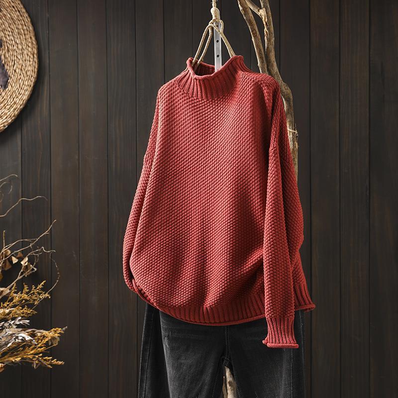 Women's textured knit sweater with ribbed crew neck and long sleeves