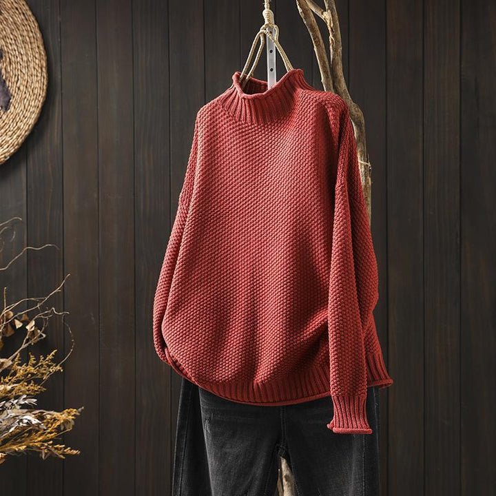 Women's textured knit sweater with ribbed crew neck and long sleeves