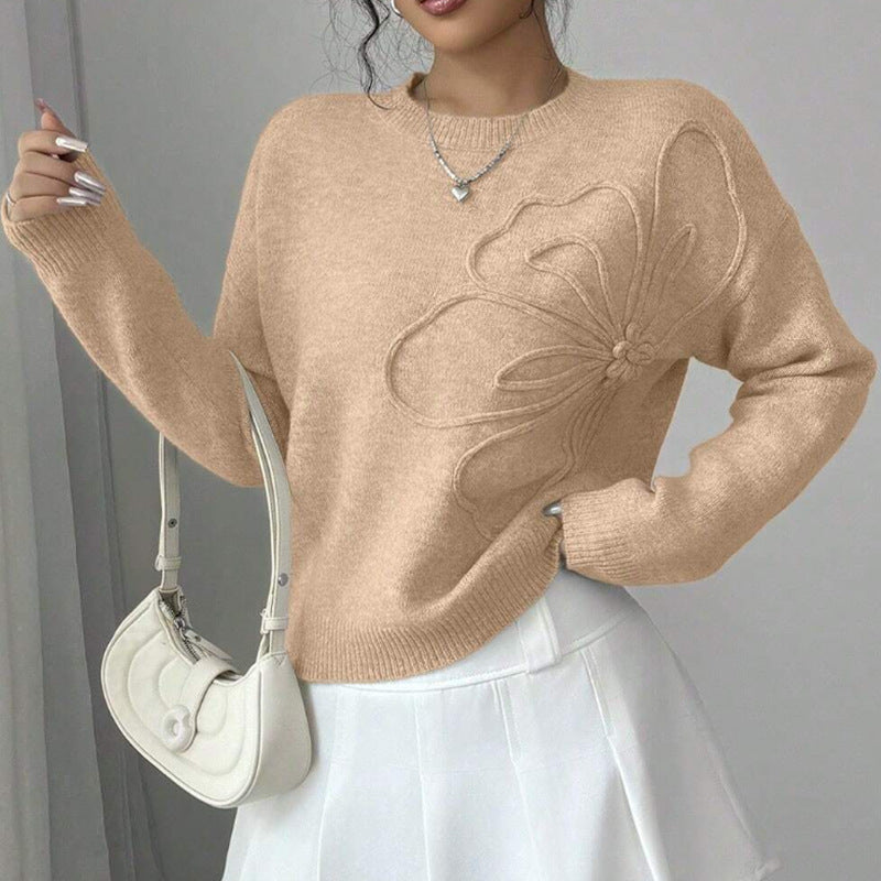 Women's crew neck sweater with long sleeves and raised floral front detail