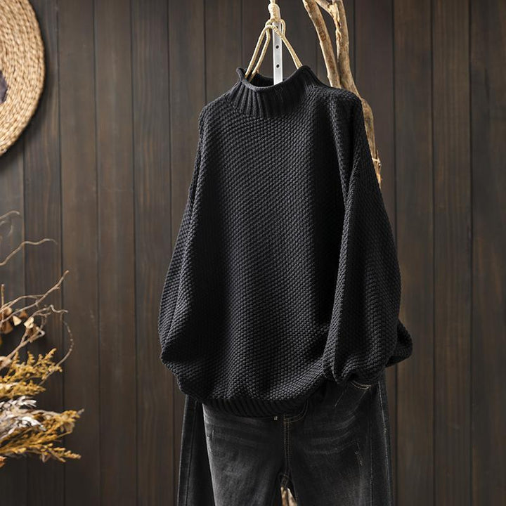Women's textured knit sweater with ribbed crew neck and long sleeves